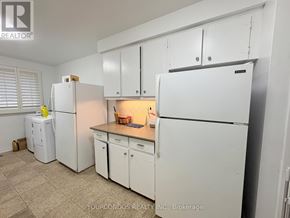 Markham (Unionville) apartment for rent - A white refrigerator and cabinets in a kitchen.
