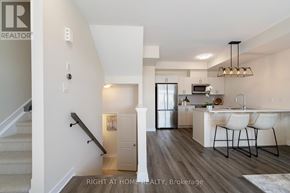 Ottawa townhouse for rent - A well-lit kitchen with a dining table and chairs.