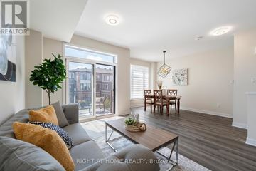 Ottawa townhouse for rent - A living room with a grey couch and a coffee table.
