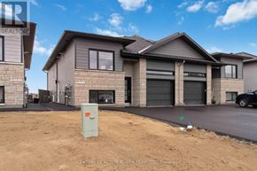 The Nation fourplex for rent - A house with a grey roof and a garage door is shown.