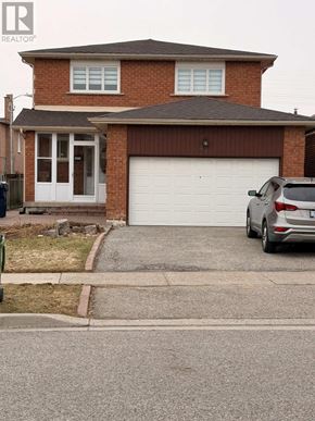 Toronto (West Humber-Clairville) apartment for rent - A house with a garage and a car parked in front.