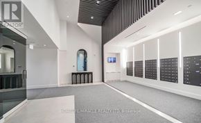Richmond Hill (South Richvale) condo for rent - A spacious room with a long hallway and a glass wall on the right side.
