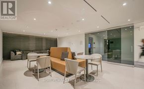 Richmond Hill (South Richvale) condo for rent - A modern living room with a glass door and a sofa.