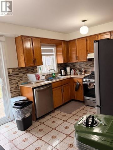 Toronto (West Humber-Clairville) apartment for rent - A kitchen with wooden cabinets and a green stove top.