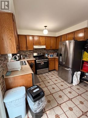 Toronto (West Humber-Clairville) apartment for rent - A house with a brown roof and a grey car parked in front.