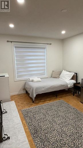 Toronto (West Humber-Clairville) apartment for rent - A bedroom with a fireplace and a bed.