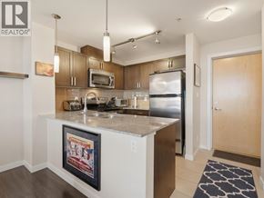 New Westminster apartment for rent - A kitchen with a fridge, microwave, and oven.