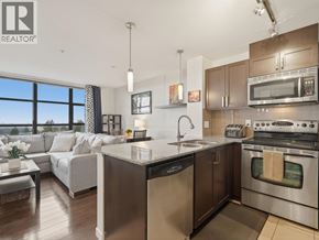 New Westminster apartment for rent - A modern kitchen with stainless steel appliances and a large island.