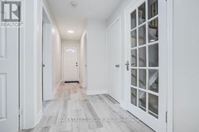 Toronto (Pleasant View) apartment for rent - A hallway with white doors and a wooden floor.