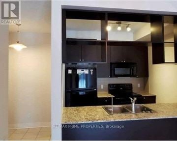 Toronto (Agincourt South-Malvern West) townhouse for rent - A kitchen with granite countertops and stainless steel appliances.