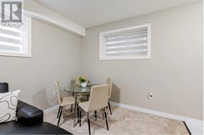 Kitchener apartment for rent - A small dining area with a glass table and four chairs.