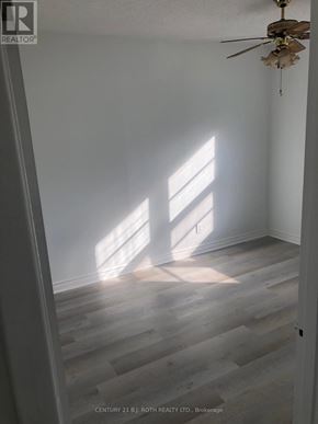 Barrie (Cundles East) apartment for rent - A room with a ceiling fan and light, and a window letting in sunlight.