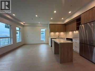 New Westminster apartment for rent - A modern kitchen with wooden cabinets and stainless steel appliances.