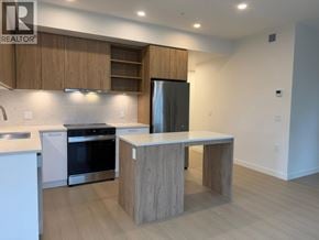 New Westminster apartment for rent - A modern kitchen with a wooden island and stainless steel appliances.