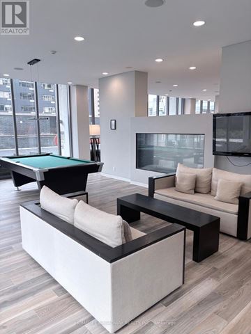 Toronto (Church-Yonge Corridor) condo for rent - A modern living room with a pool table and a television.