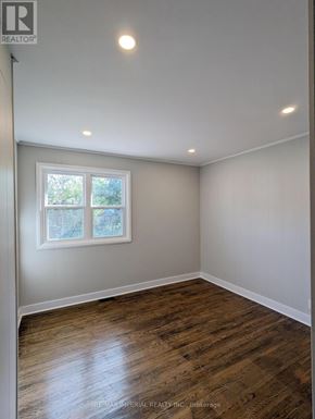 Kawartha Lakes (Lindsay) multi-family for rent - A room with a window and wooden flooring.