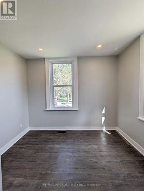 Kawartha Lakes (Lindsay) multi-family for rent - A room with a window and wooden flooring.