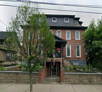 East Stroudsburg apartment for rent - A house with a flag on the front porch.