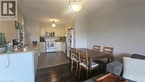 Kitchener townhouse for rent - A kitchen with a dining table and chairs.