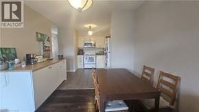 Kitchener townhouse for rent - A kitchen with a table and chairs in the middle of the room.