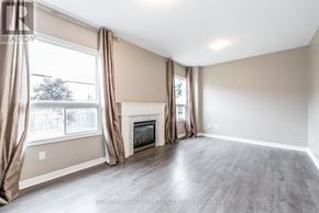 Markham (Village Green-South Unionville) apartment for rent - A spacious living room with a fireplace and large windows.