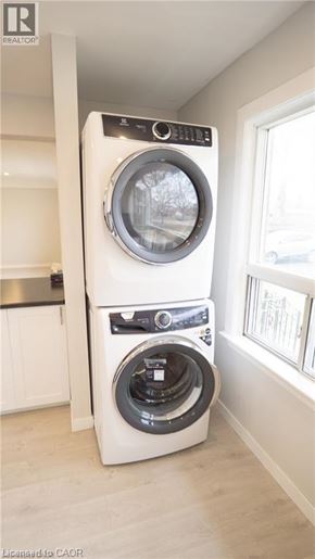 St. Catharines apartment for rent - A white front load washing machine in a laundry room.