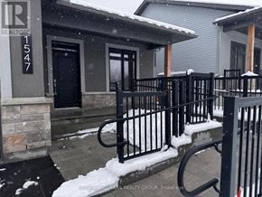 Brockville townhouse for rent - A snowy scene with a house number 1547.