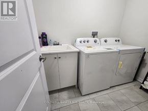 Whitby (Lynde Creek) apartment for rent - A bathroom with two sinks and a toilet.