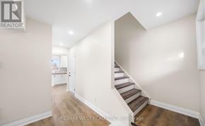 Barrie (Allandale Heights) apartment for rent - A hallway with a staircase leading to the second floor.