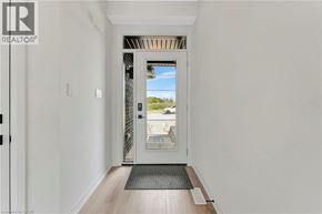 Paris townhouse for rent - A hallway with a door leading outside.