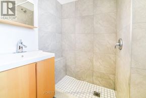 Toronto (Yonge-Eglinton) apartment for rent - A bathroom with a white sink and a tiled floor.