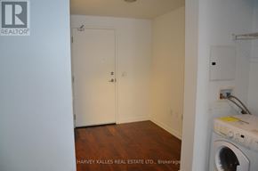 Toronto (Moss Park) condo for rent - A laundry room with a washer and dryer.