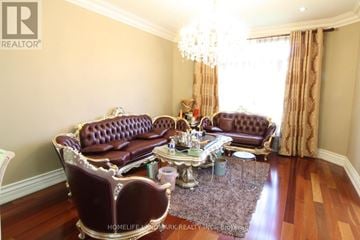 Toronto (Agincourt South-Malvern West) apartment for rent - A living room with a brown leather sofa and a matching armchair.