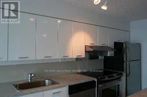 Toronto (Bayview Village) condo for rent - A kitchen with white cabinets and a sink.
