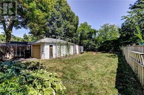 Toronto (Wexford-Maryvale) apartment for rent - A backyard with a shed and a fence.