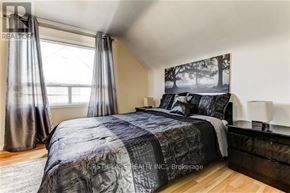 Toronto (Wexford-Maryvale) apartment for rent - A bedroom with a bed, nightstand, and window.