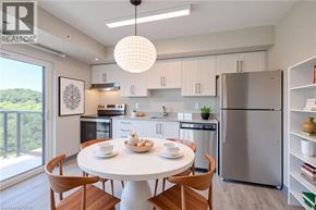 Kitchener apartment for rent - A modern kitchen with a dining table set for two.