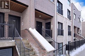 Oakville (Jm Joshua Meadows) townhouse for rent - A building with a sign that says REALTOR on the front.