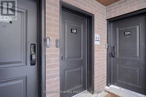 Oakville (Jm Joshua Meadows) townhouse for rent - Three doors with numbers 338, 220 and 220 on them.