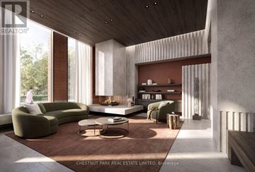 Toronto (Rosedale-Moore Park) condo for rent - A modern living room with a green sofa and a fireplace.