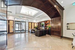 Ottawa condo for rent - A spacious lobby with a wooden ceiling and a glass wall.
