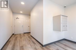 Hamilton (Stoney Creek) townhouse for rent - A room with a white door and a white cabinet on the wall.