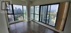 Toronto (Church-Yonge Corridor) condo for rent - A large room with a view of the city through the windows.