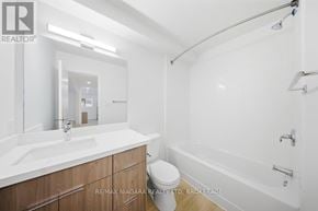 Prince Edward County (Picton Ward) multi-family for rent - A white bathroom with a sink, toilet and bathtub.