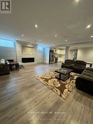 Richmond Hill (Langstaff) apartment for rent - A living room with a rug and a fireplace.