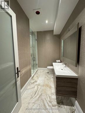 Richmond Hill (Langstaff) apartment for rent - A bathroom with a marble floor and a white sink.