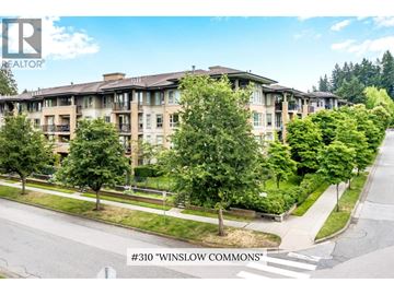 Vancouver apartment for rent - A street view of a residential area with apartment buildings and trees.