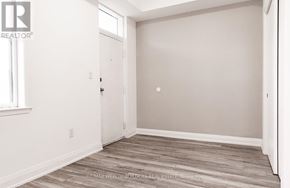 Toronto (Moss Park) multi-family for rent - A room with a door and a window.