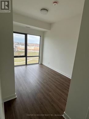 Clarington (Bowmanville) condo for rent - A room with a view of the outside through a large window.