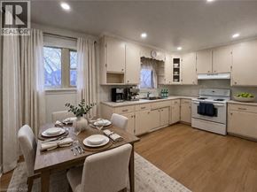 Kitchener apartment for rent - A well-lit kitchen with a dining table set for two.